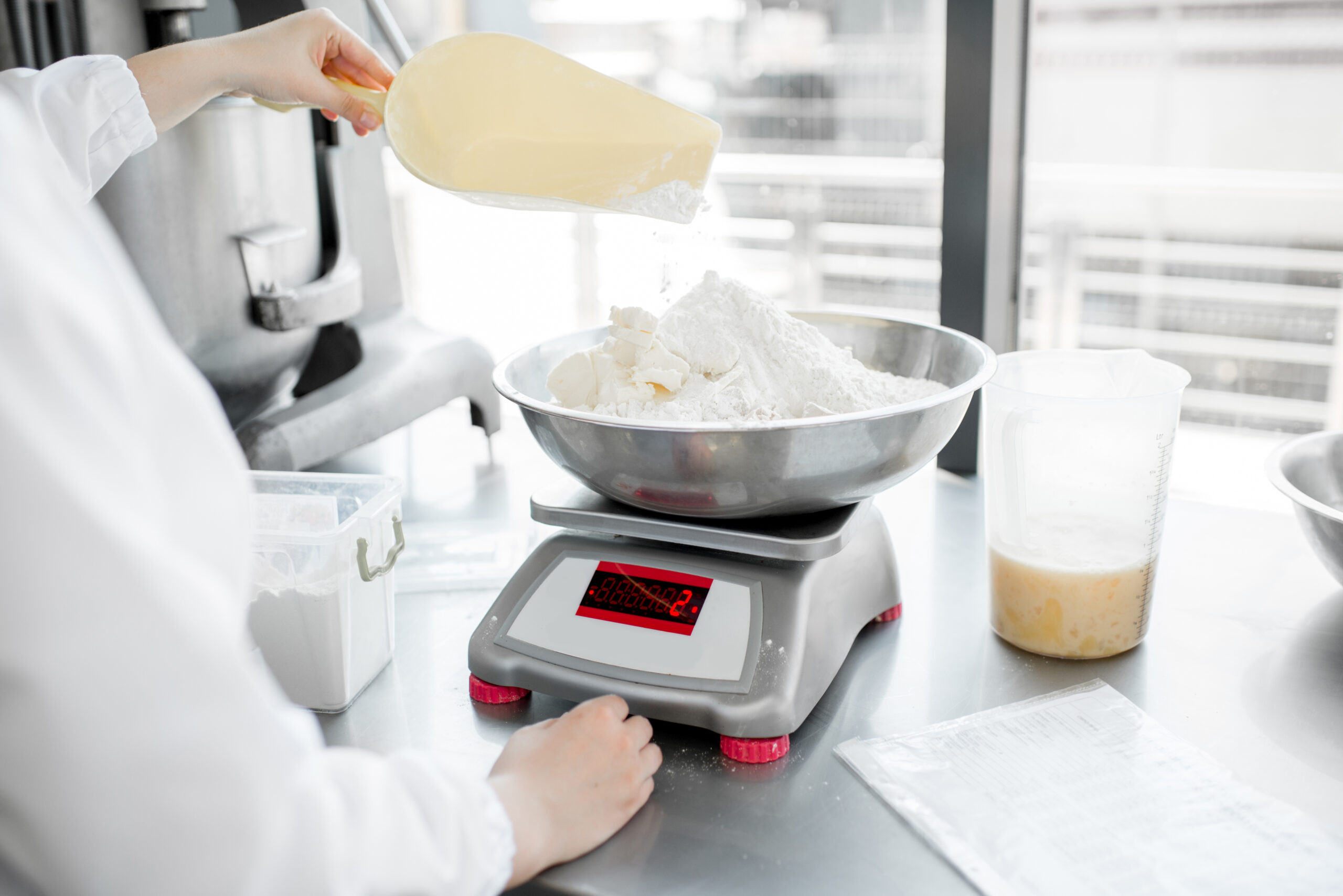 Weighing flour for baking at the manufacturing
